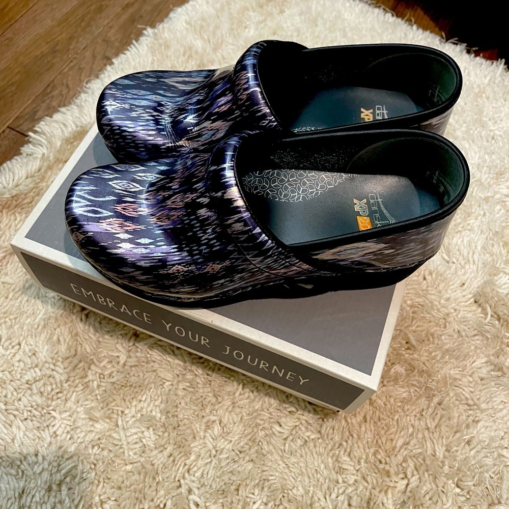 Black and lavender Dansko shoes barely worn with no scuffs or tears.